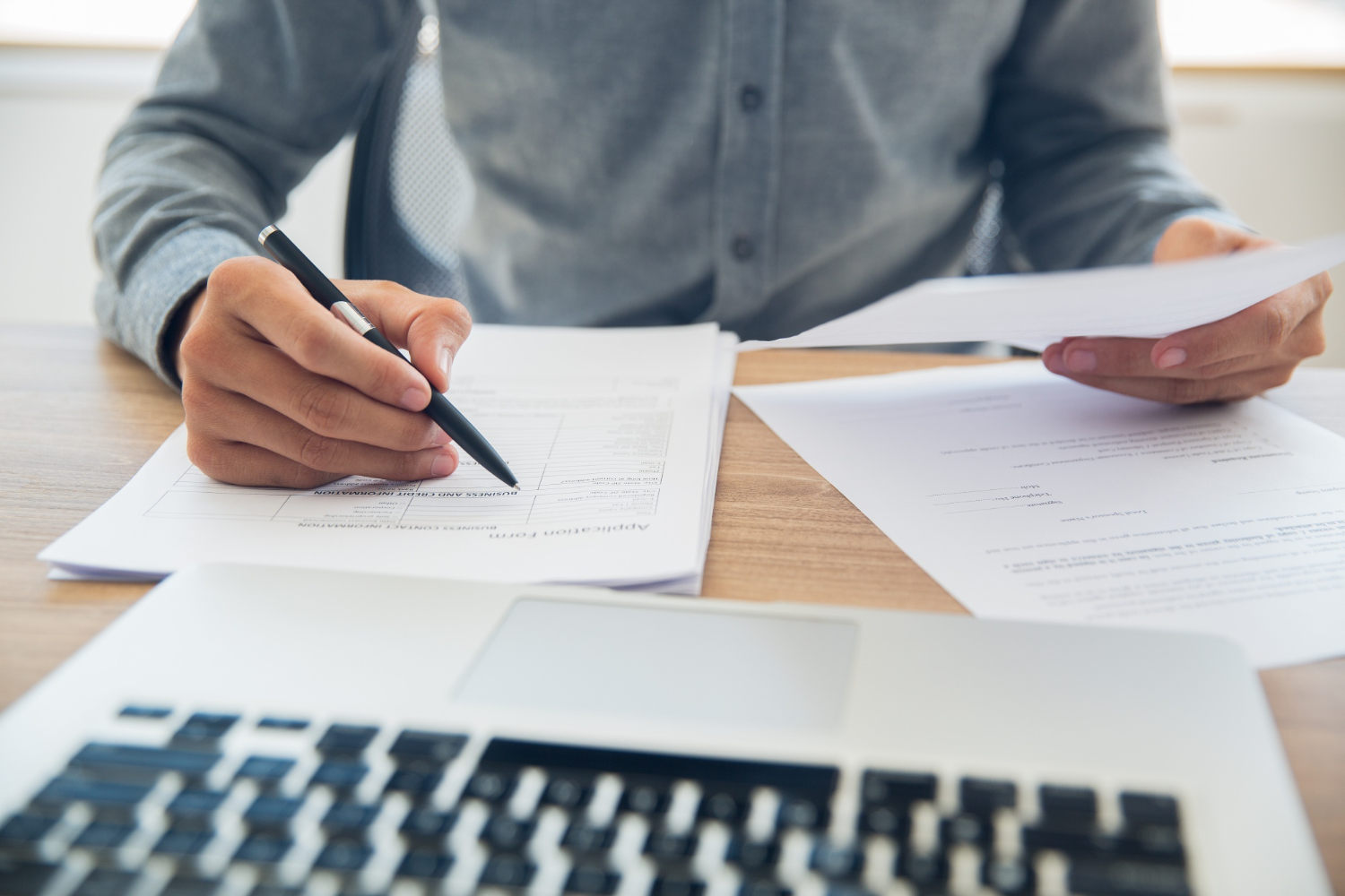 businessman-checking-documents-at-table