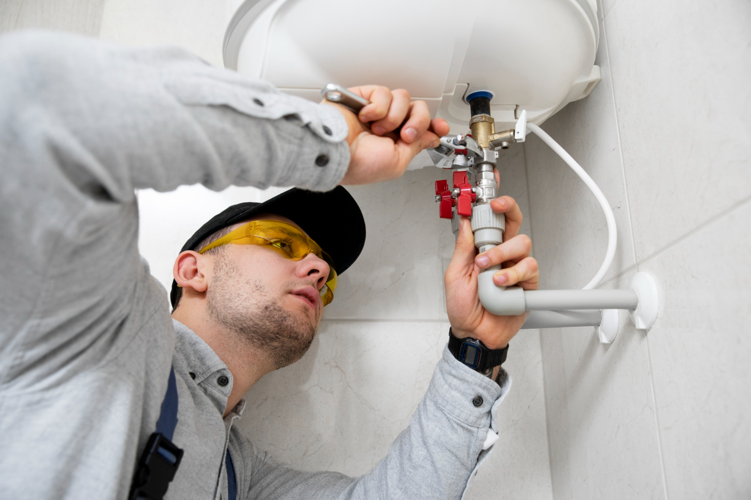 worker-repairing-water-heater